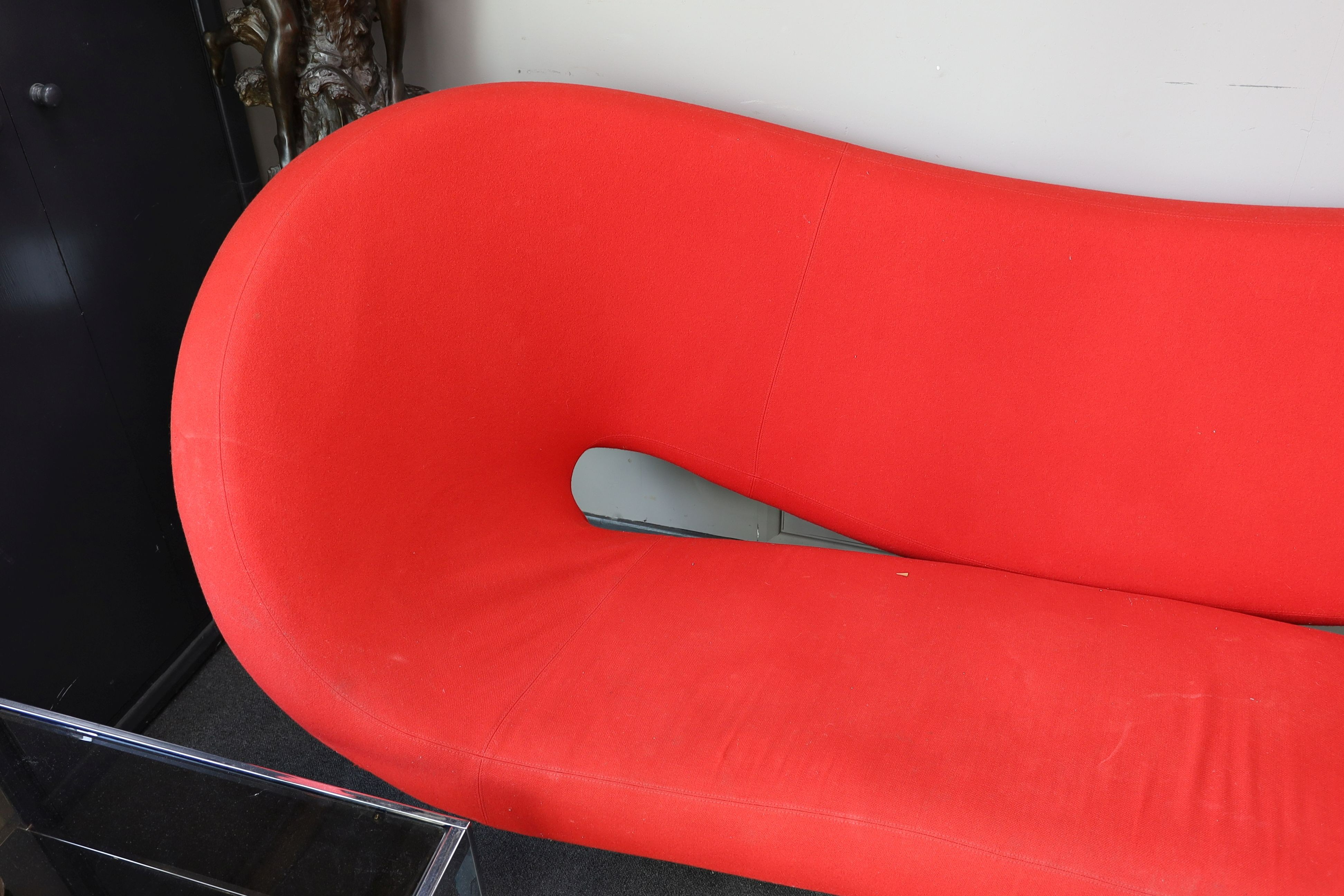 A Ron Arad, 'Moroso' sofa upholstered in red fabric, length 240cm, depth 94cm, height 100cm